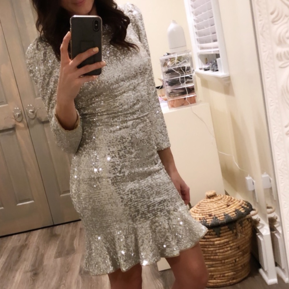 New Year’s Eve style Silver sequin short dress zipper up and has some stretch